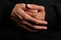 Folded hands of a priest Royalty Free Stock Photo