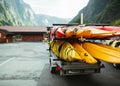 Folded kayaks in a trailer against the backdrop of the mountains of norway Royalty Free Stock Photo