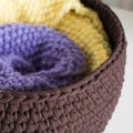 Folded knitted blankets in the basket