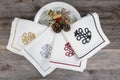 Folded linen napkins on wooden table. luxury napkins with embroidery on the hem