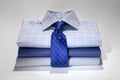 Folded Man`s shirts and ties isolated on white background Royalty Free Stock Photo