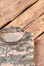 Folded military clothes on wood.