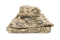 Folded military uniform and cap isolated on background