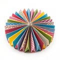 Folded multicolored circular paper isolated on white background