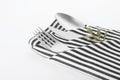 Folded napkin with fork, spoon and knife Royalty Free Stock Photo