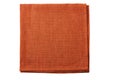 Folded natural brown textile napkin on white Royalty Free Stock Photo