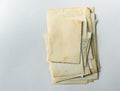 Folded old photos on a white table. Postcard rumpled and dirty vintage. Retro postcard Royalty Free Stock Photo