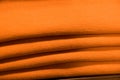 Folded orange sweatshirts