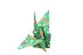 Folded origami paper crane green