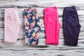 Folded pants of different color.