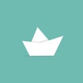 Folded paper boat isolated on turquoise with word ahoy. Powder blue background