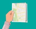 Folded paper city map in hand Royalty Free Stock Photo