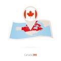 Folded paper map of Canada with flag pin of Canada Royalty Free Stock Photo