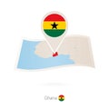 Folded paper map of Ghana with flag pin of Ghana Royalty Free Stock Photo