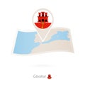 Folded paper map of Gibraltar with flag pin of Gibraltar