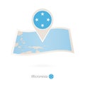 Folded paper map of Micronesia with flag pin of Micronesia