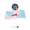 Folded paper map of New York U.S. State with flag pin of New York Royalty Free Stock Photo