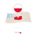Folded paper map of Poland with flag pin of Poland Royalty Free Stock Photo