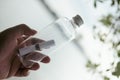 A folded paper note in a glass bottle on a blurry background. Concept of sea mail Royalty Free Stock Photo