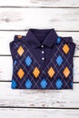 Folded patterned sweater polo shirt. Royalty Free Stock Photo