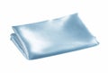 Folded piece of light blue satin fabric isolated on white background Royalty Free Stock Photo