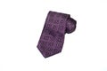 Folded purple tie on a white background