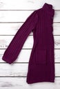 Folded purple woolen coat.