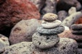 Folded pyramid of smooth stones on the seashore, zen stone Royalty Free Stock Photo