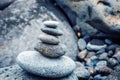 Folded pyramid of smooth stones on the seashore, zen stone Royalty Free Stock Photo