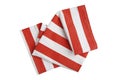 Folded red and white dishcloth isolated top view. Fodd design decorative napkin. Kitchen cloth