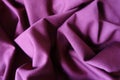 Folded reddish violet viscose stockinette fabric