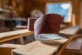 Folded sand paper close up shot in a small woodworking shop, vibrant blue sky through window Royalty Free Stock Photo