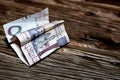 5 Saudi Riyals banknotes on wooden table, Saudi money inflation and economy world crisis concept