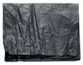 Folded sheet of crumpled black parchment paper on white isolated background Royalty Free Stock Photo