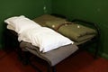 Folded sheets and blankets in a vintage military army barracks