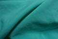Folded thin bluish green chiffon fabric