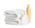 Folded soft towels and toiletries on background