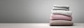 Folded Spring Clothing Stack in Neutral Studio Placed on Table With Plain Background for Display and Organization Royalty Free Stock Photo