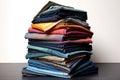 folded stack of various denim fabric shades