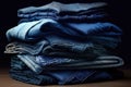 folded stack of various denim fabric shades