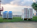 Folded sun loungers. End of season at the resort concept . The rest is over. Sunbeds stacked on top of each other. Business on Royalty Free Stock Photo