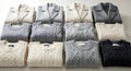 Folded Sweaters and Coats in Soft Neutrals, Organized and Clean Royalty Free Stock Photo