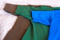 Folded t-shirts different colours. T-shirt sleeves close up