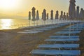 Folded umbrellas on the beach.