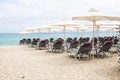 Folded umbrellas on the beach before the storm on the coast of G