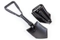 Folded and unfolded modern steel entrenching tools on white background Royalty Free Stock Photo