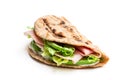 Folded wholemeal flatbread with ham and vegetables isolated on white Royalty Free Stock Photo