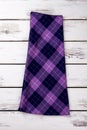 Folded woolen purple checkered skirt.