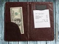 Folder with bill and money