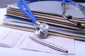 Folder file and stethoscope on the desk Royalty Free Stock Photo